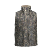 The Tom Beckbe Fowler Vest in Mossy Oak Original Bottomland is a camo puffer with a high collar, front buttons, and two large pockets.