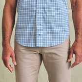 Man wearing Tom Beckbe Powell Performance Shirt (Short Sleeve) in blue and white plaid with beige pants.