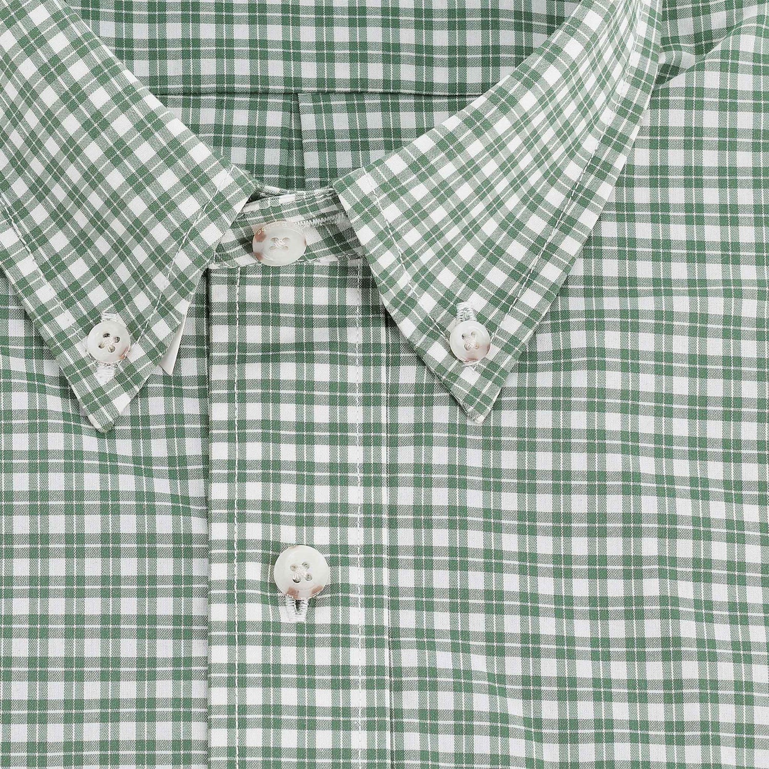 Close-up of Tom Beckbe Powell Performance Shirt: green/white plaid, white buttons, collar, UPF 30+ sun protection.