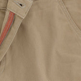 Close-up of tan fabric on Reid Short by Tom Beckbe showcases the antique brass zip fly, stitching, and texture.