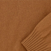 Close-up of the Saunders Crewneck Sweater by Tom Beckbe, a brown mens wool sweater with ribbed cuffs and classic details.