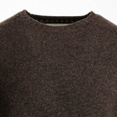 Close-up of the Tom Beckbe Saunders Crewneck Sweater in brown wool, styled on a white background.