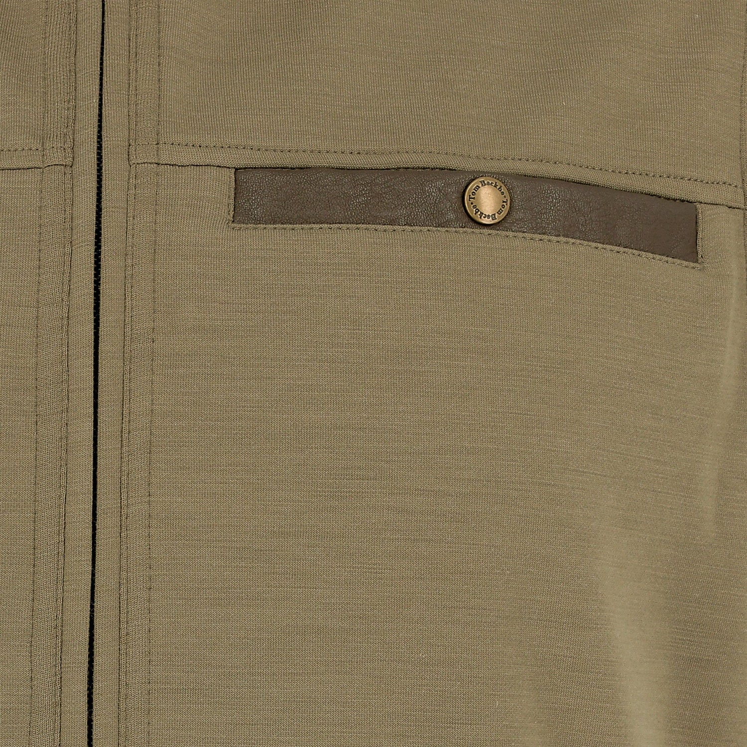 Close-up of the Tom Beckbe Tucker Fleece Quarter Zip in khaki with brown trim and a buttoned chest pocket.