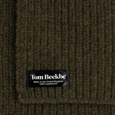 Close-up of a Tom Beckbe Wool Scarf, ribbed dark green, 100% lambswool, made in the UK.