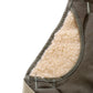 Close-up of a garment showing brown outer fabric and soft beige fleece lining with visible stitching.