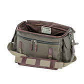Tom Beckbe DU Canvas Field Bag in olive green with brown leather accents, open to show interior and zippered pockets.