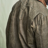 Rear view close-up of a person in the Tom Beckbe Steward Jacket featuring a corduroy collar.