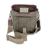 Open khaki DU Timber Bag with brown leather trim by Tom Beckbe; label reads DUCKS UNLIMITED inside.