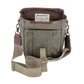 Open khaki DU Timber Bag with brown leather trim by Tom Beckbe; label reads DUCKS UNLIMITED inside.