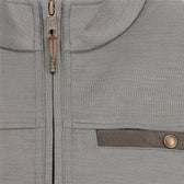 Close-up of a light grey zip-up jacket with a brown horizontal pocket trim and a metallic button detail.