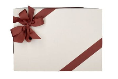 A white gift box with a red ribbon and bow on the top left corner.