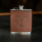 The Tom Beckbe Yellowstone Hip Flask (6oz) features a brown leather-wrapped metal design with an engraved Y.